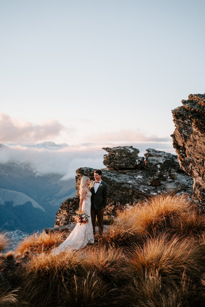 bride and groom in queenstown mountain top