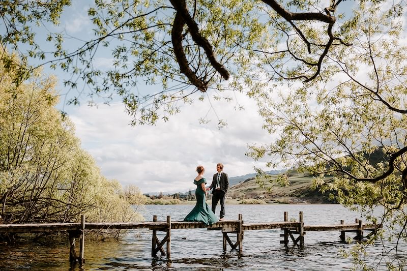 bride and group by a lake