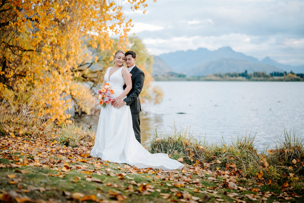 bride and groom after wedding ceremony at lake hayes queenstown new zealand