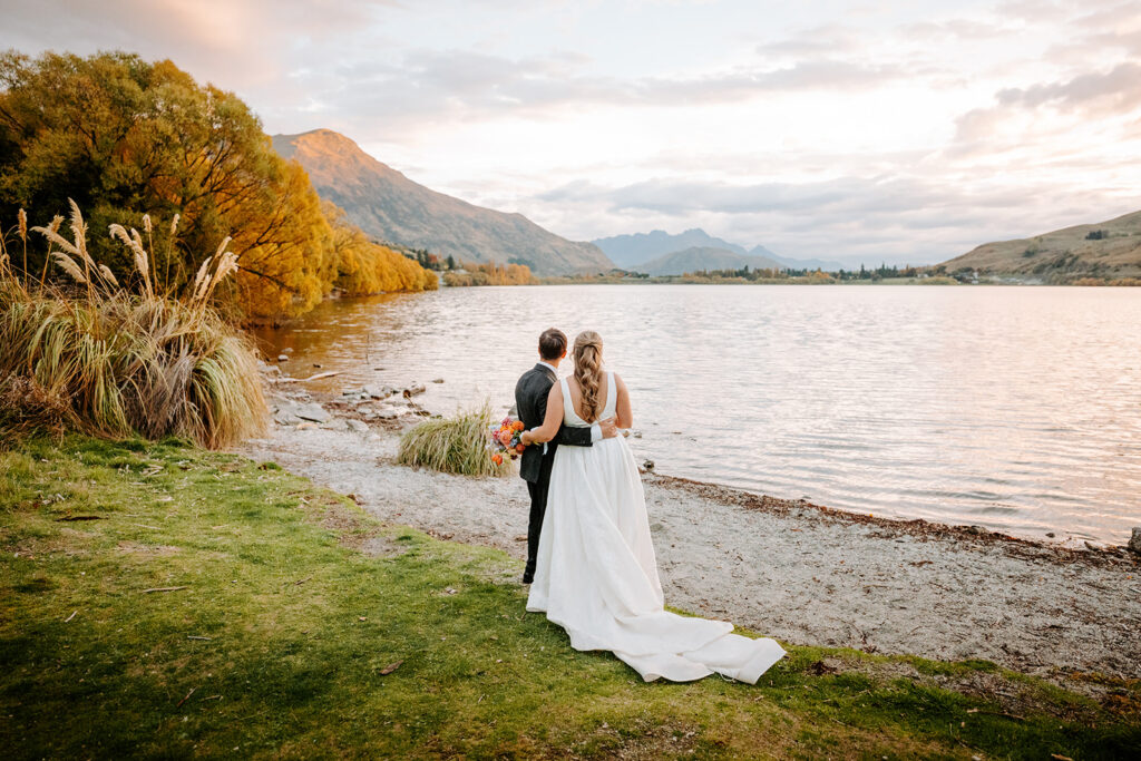 bride and groom after wedding ceremony at lake hayes queenstown new zealand